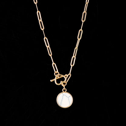 Cross Chain Necklace with Geometric Circular Pendant