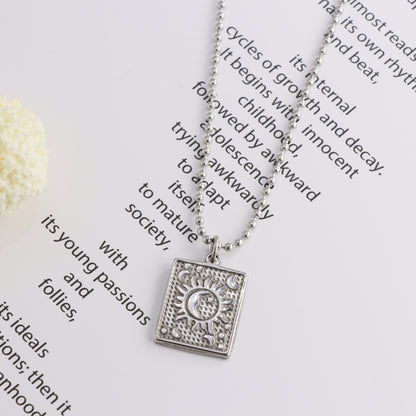 Buddha bead chain with square pendant of sun and moon