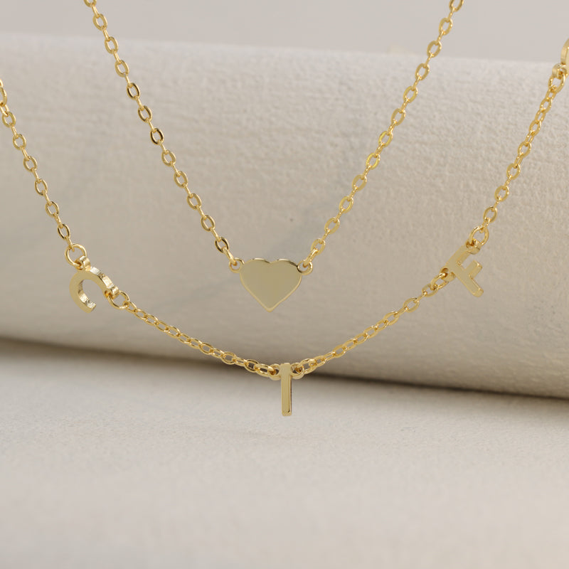 Elegant stainless steel O-ring chain with heart and letter pendant