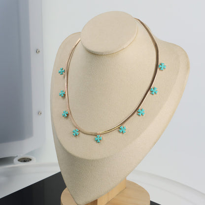 Elegant Blue Four-Leaf Clover Necklace with Modern Design