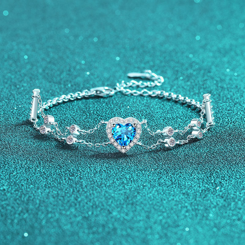 Princess Celestial Bracelet: Choose 1ct Moissanite, 1ct Blue Moissanite, or 6.5mm Heart Zircon. Set in rhodium-plated sterling silver.