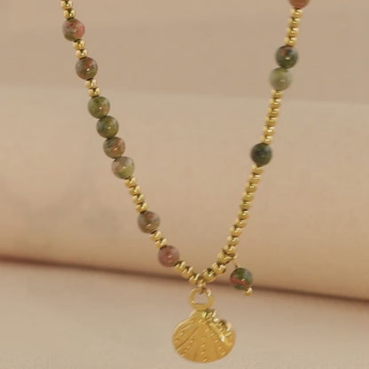 Gold O-chain necklace with natural stone and metal shell pendant